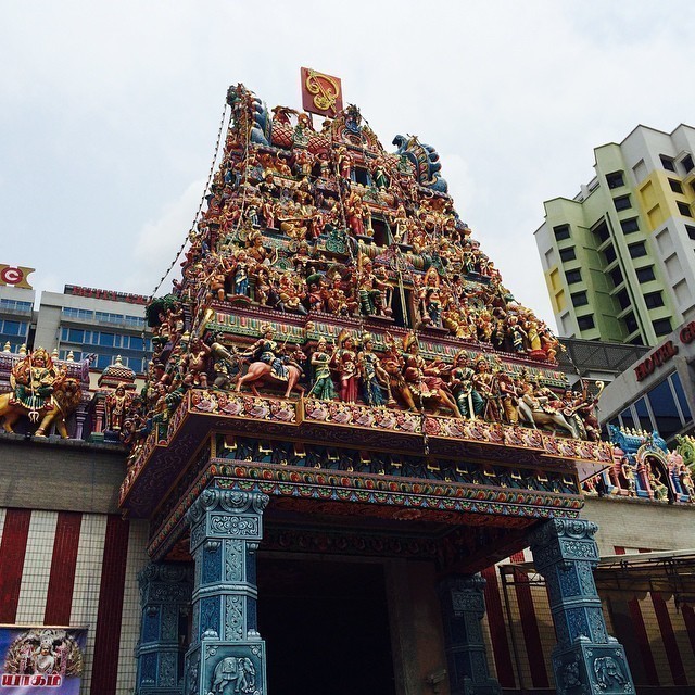 Contrasts: Temple vs high rise buildings behind. #singapore