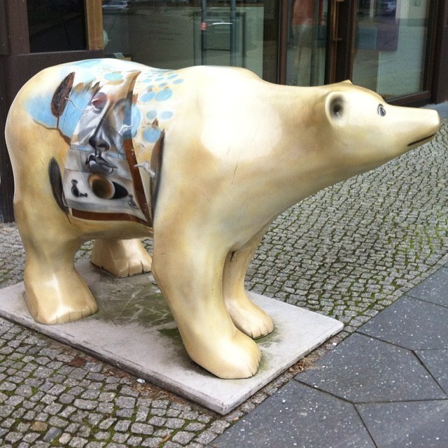 A bear with Salvador #Dali artwork outside the